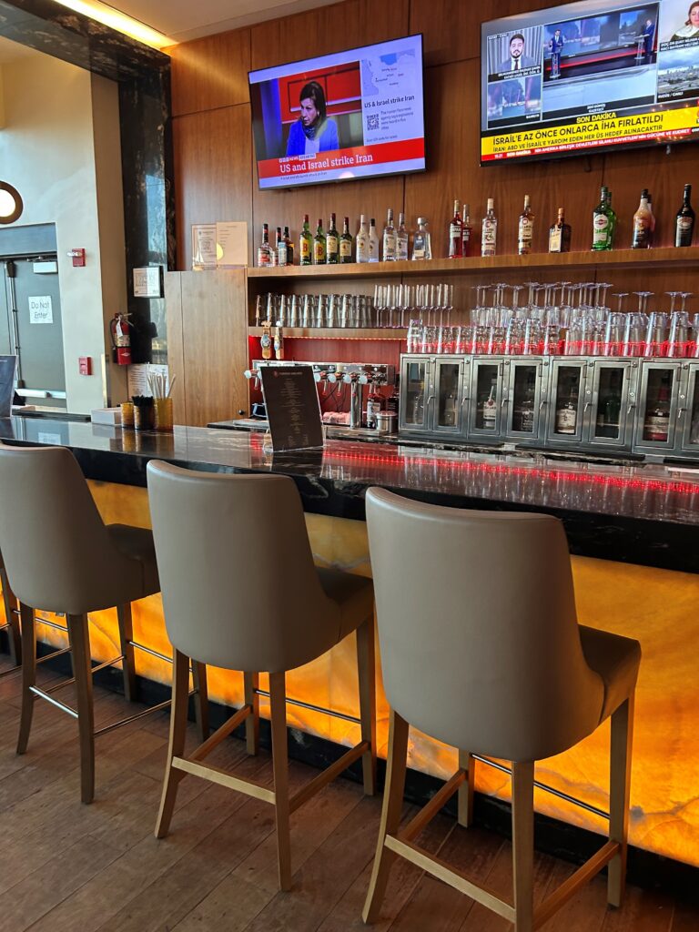 a bar with chairs and a counter