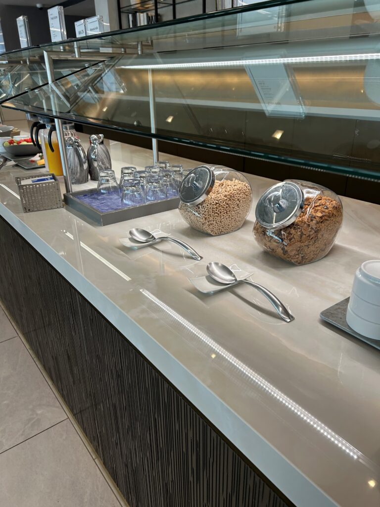 a counter with cereal and other food items
