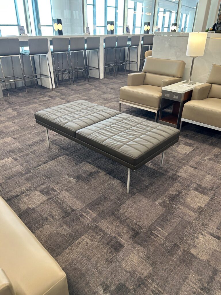 a room with chairs and a bench