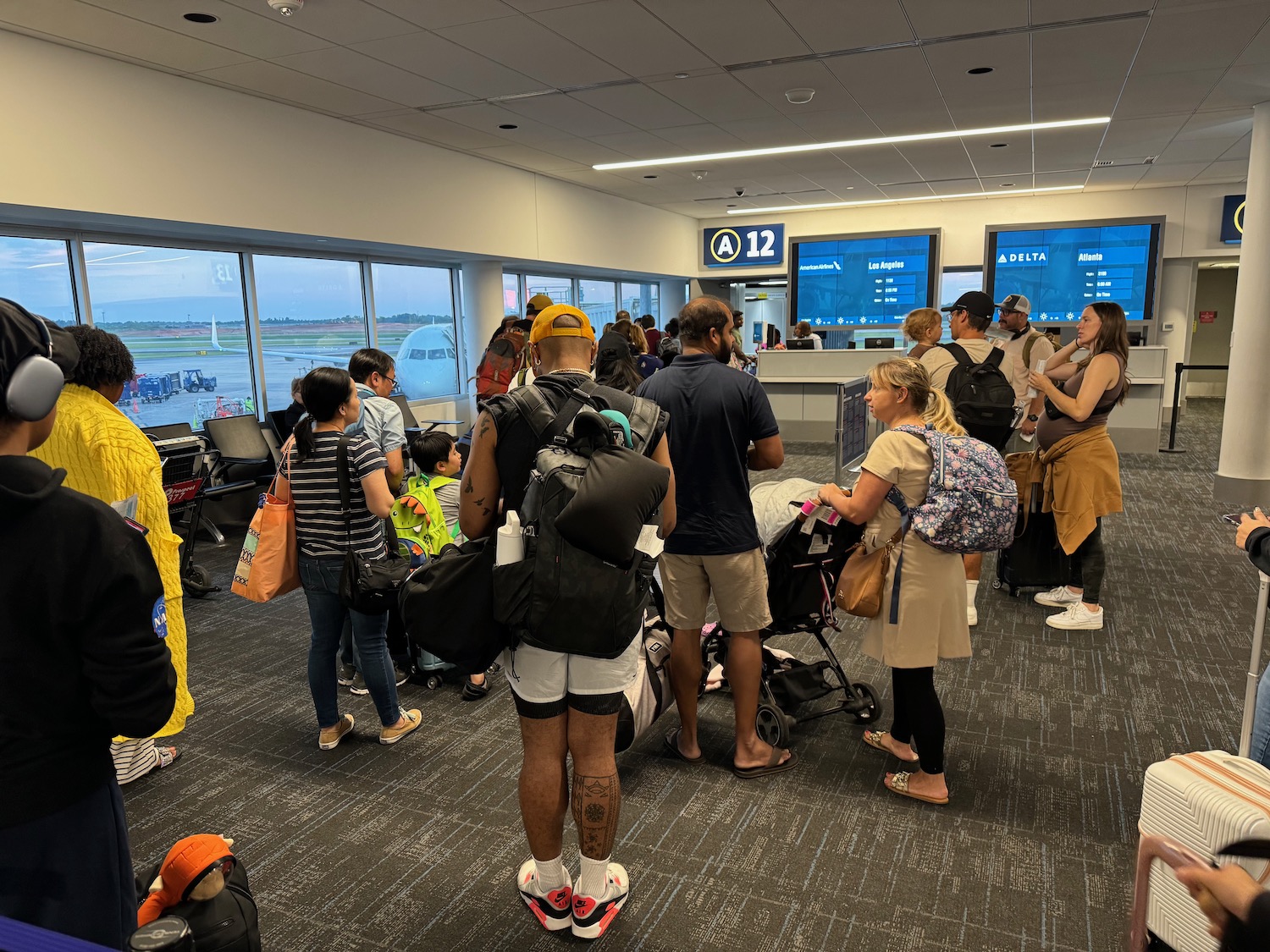 American Airlines Gate Agent Warns Carry-On Bags Will Be Checked For Those Who Attempt To Board Before Group Number Called