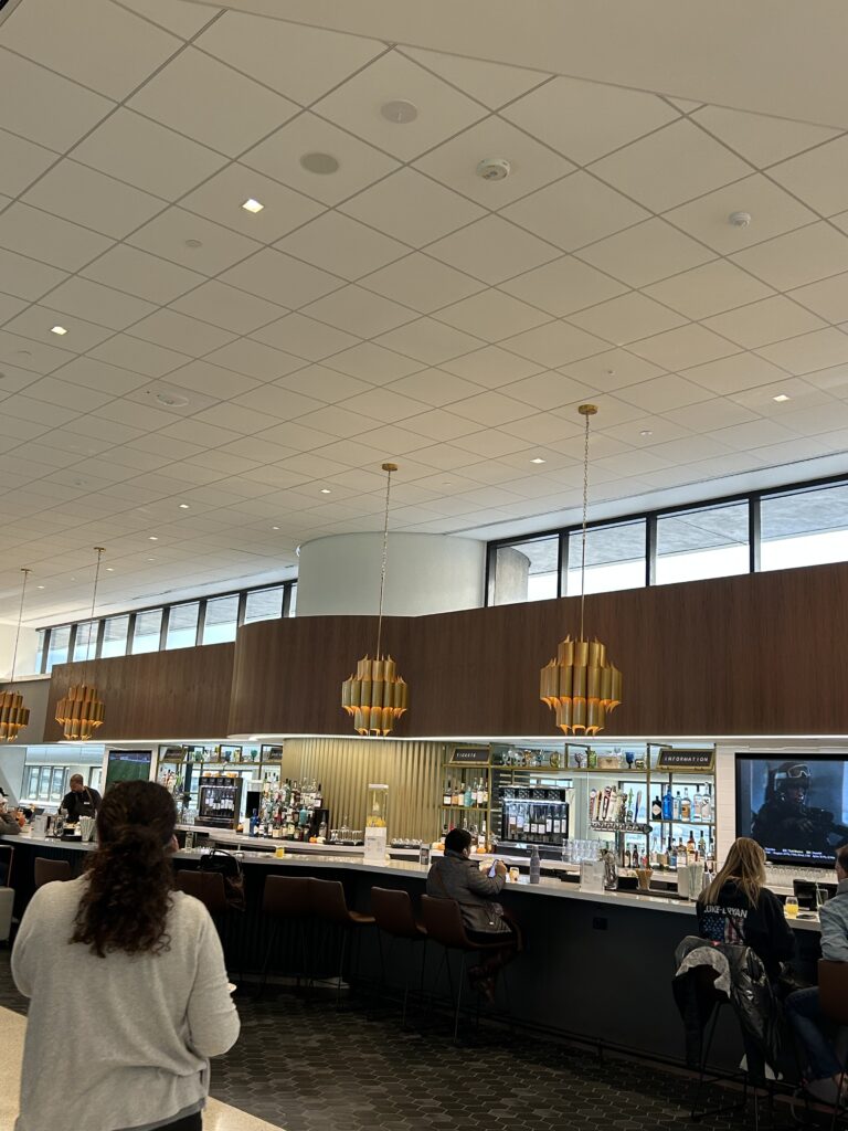 people sitting at a counter in a building