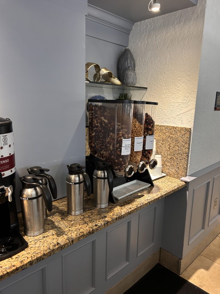 a coffee maker dispenser with food in it