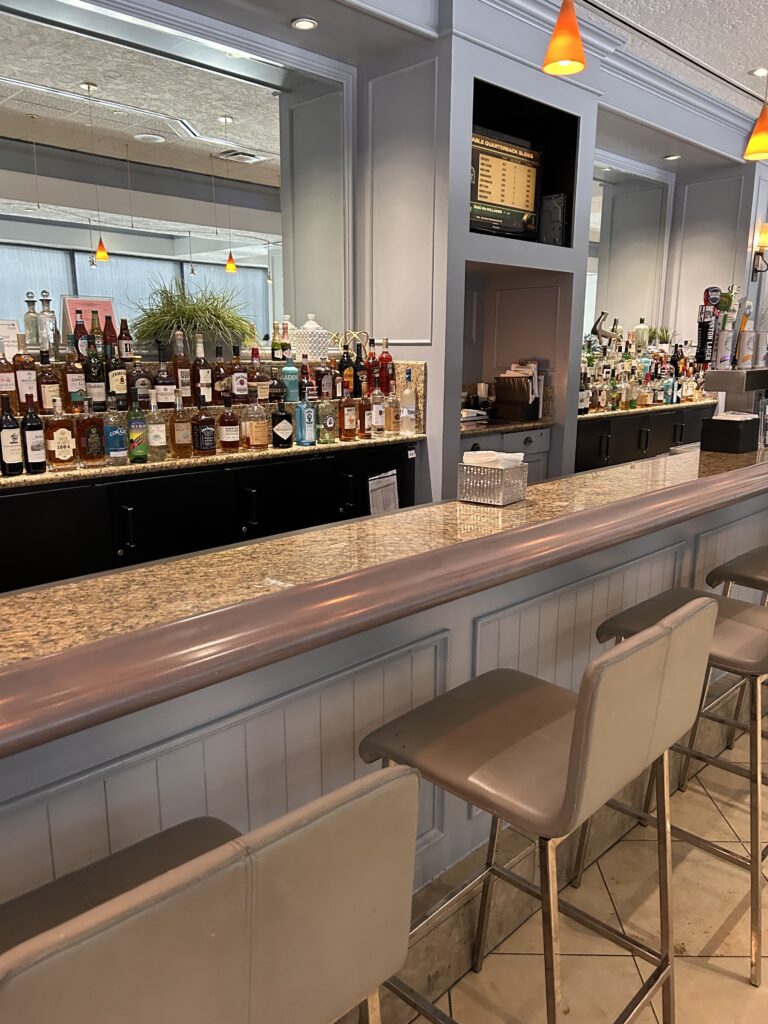 a bar with many bottles of alcohol