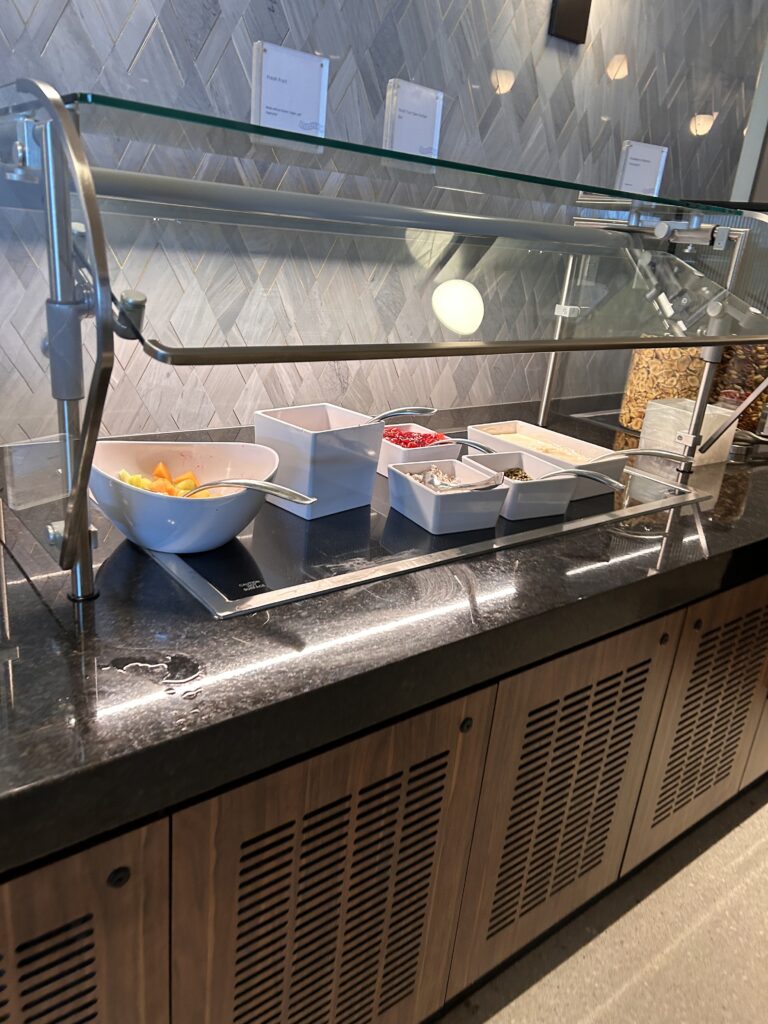 a buffet counter with food items on it