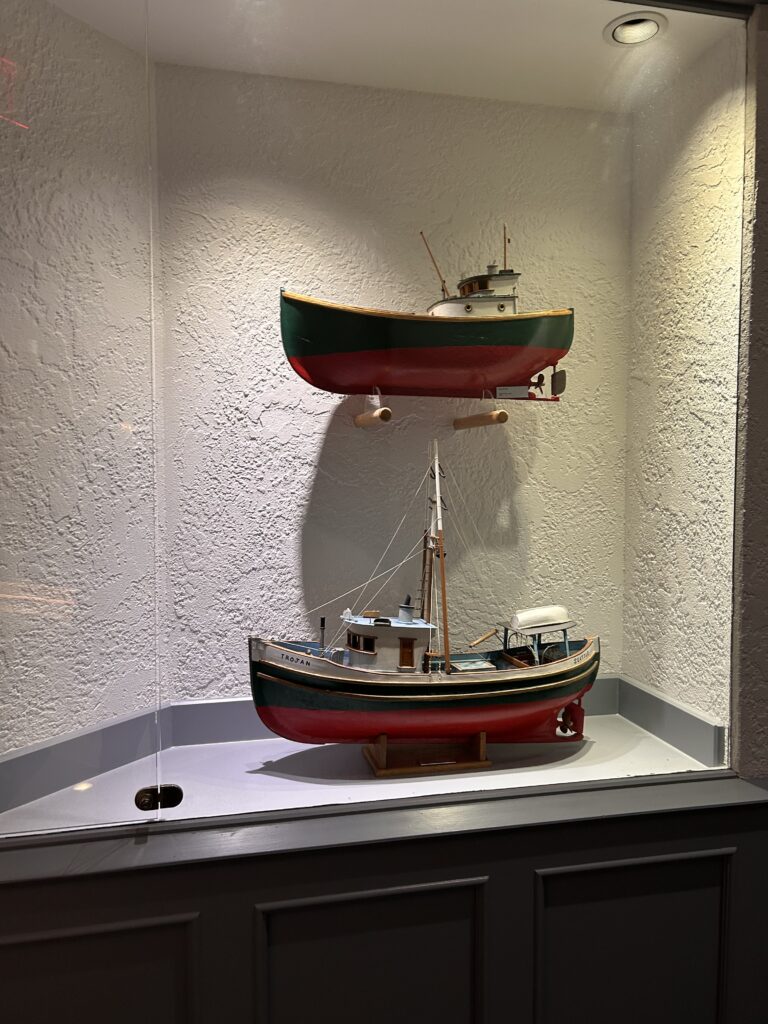 a model boats in a glass case