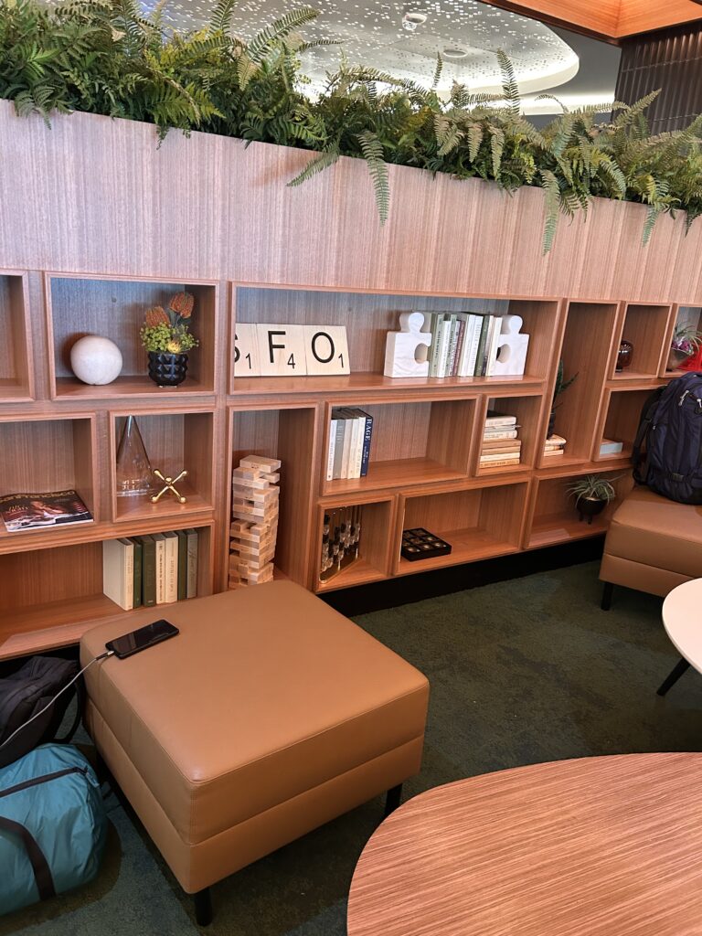 a room with a bookcase and chairs