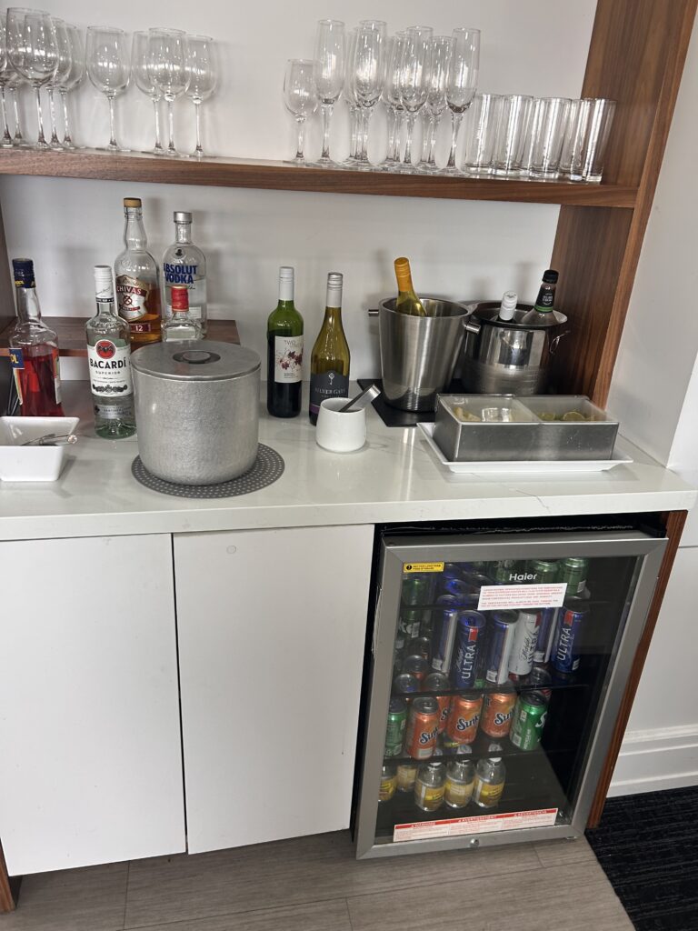 a bar with bottles and drinks