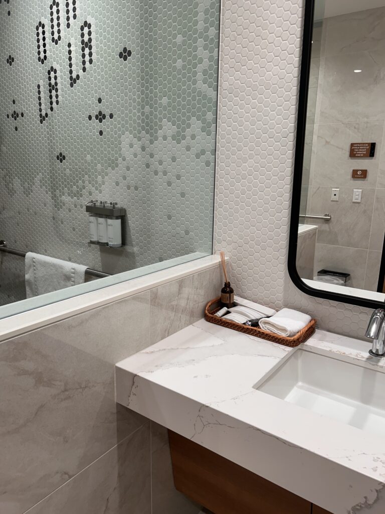 a bathroom with a mirror and sink