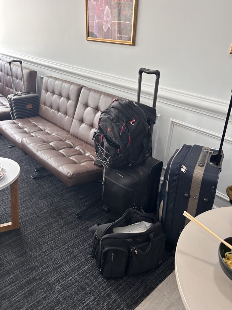 a group of luggage on a couch