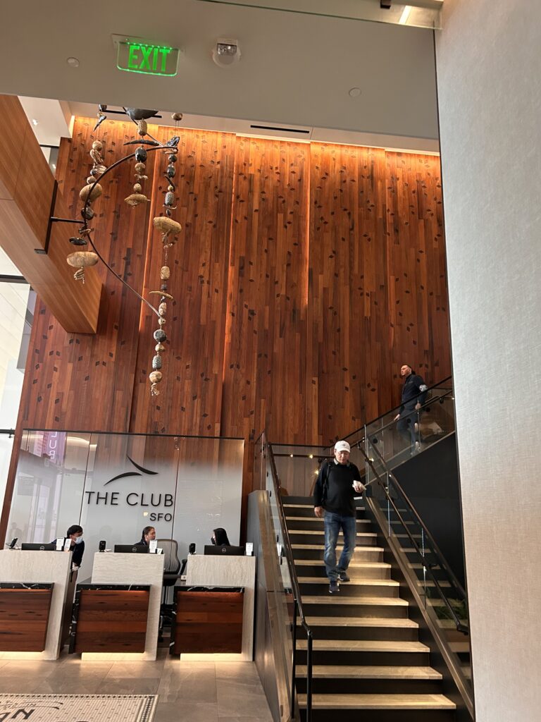a man walking up stairs in a building