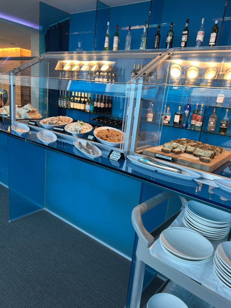 a buffet with plates and food on it