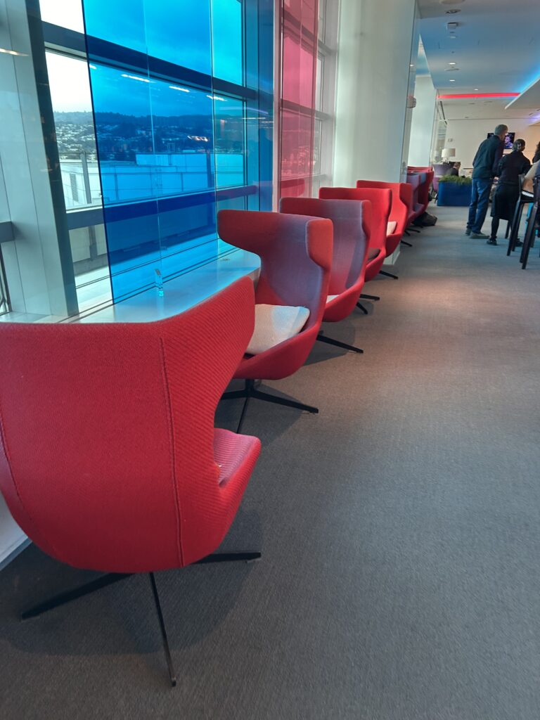 a row of red chairs in a room
