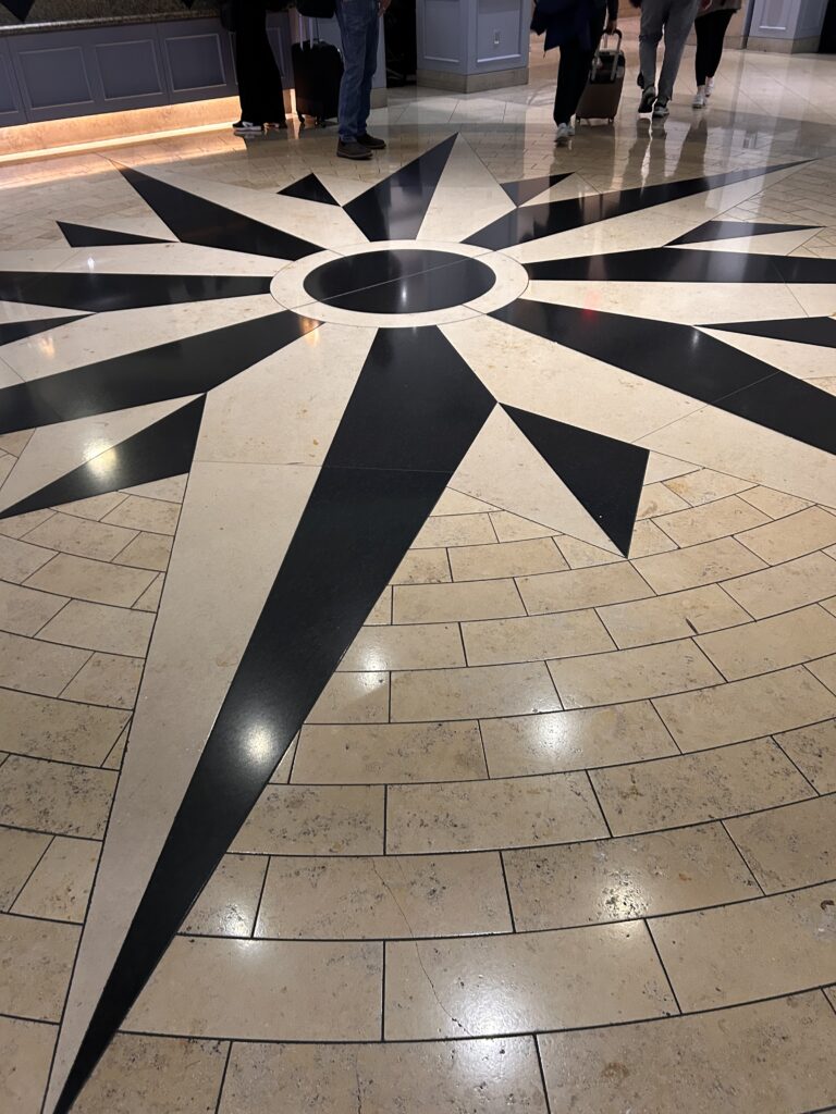 a black and white tile floor with a star design