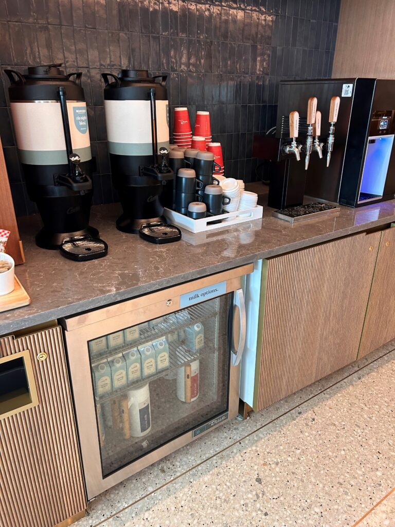 a coffee machine and a dispenser on a counter