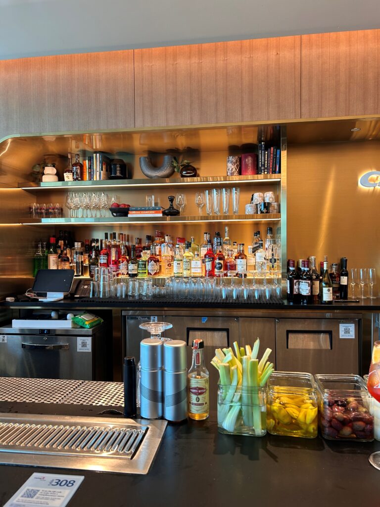 a bar with shelves of liquor and glasses