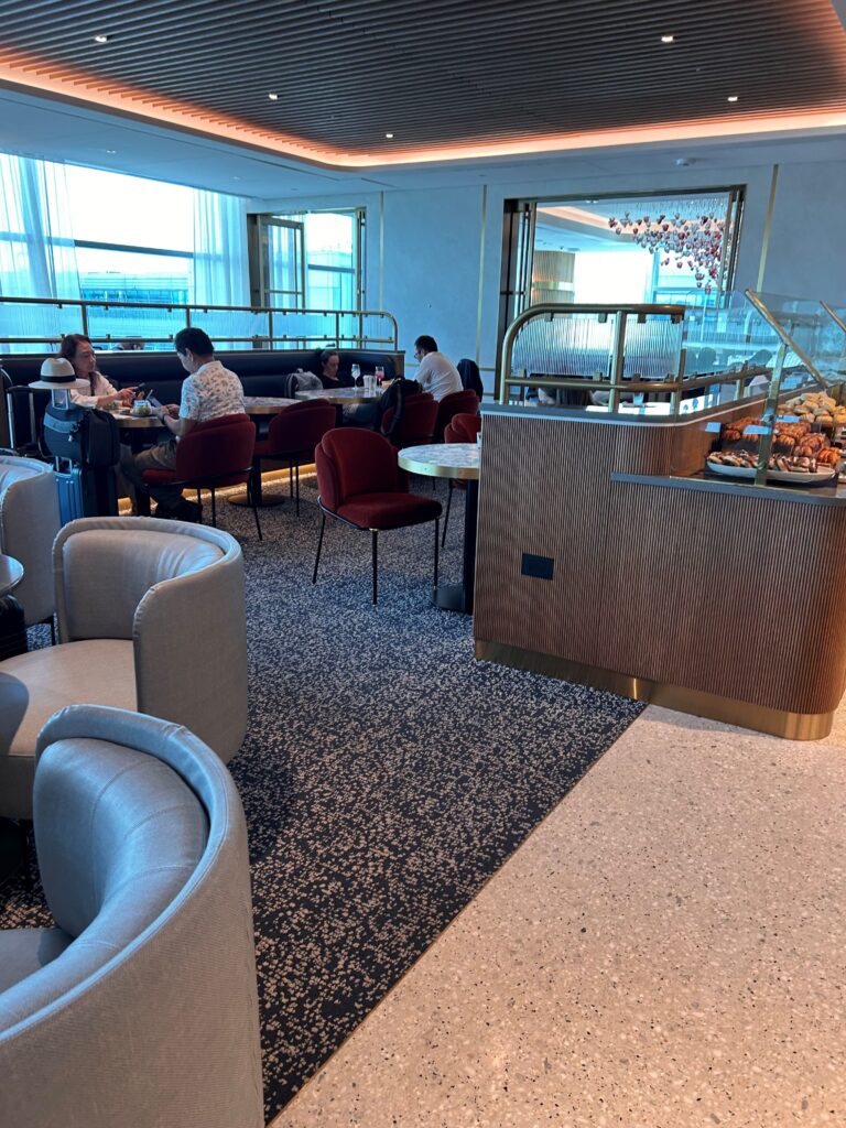 a group of people sitting at tables in a restaurant