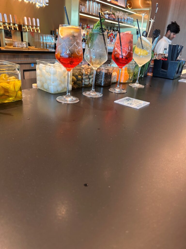 a group of drinks on a bar