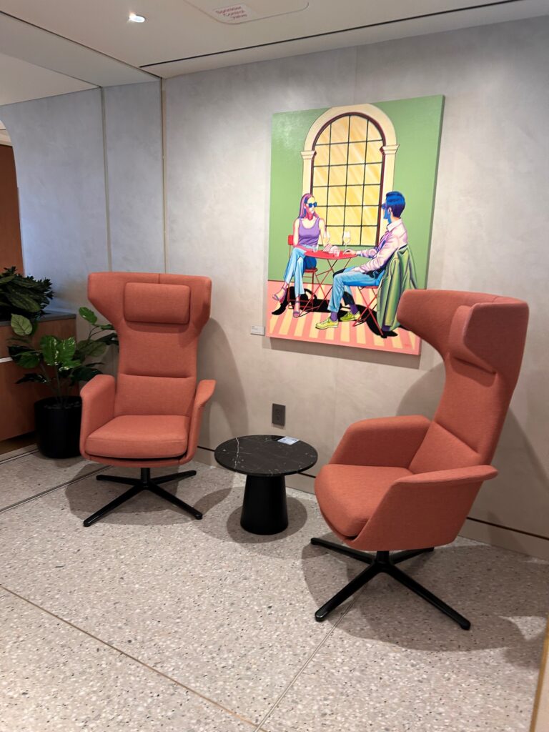 two chairs and a table in a room