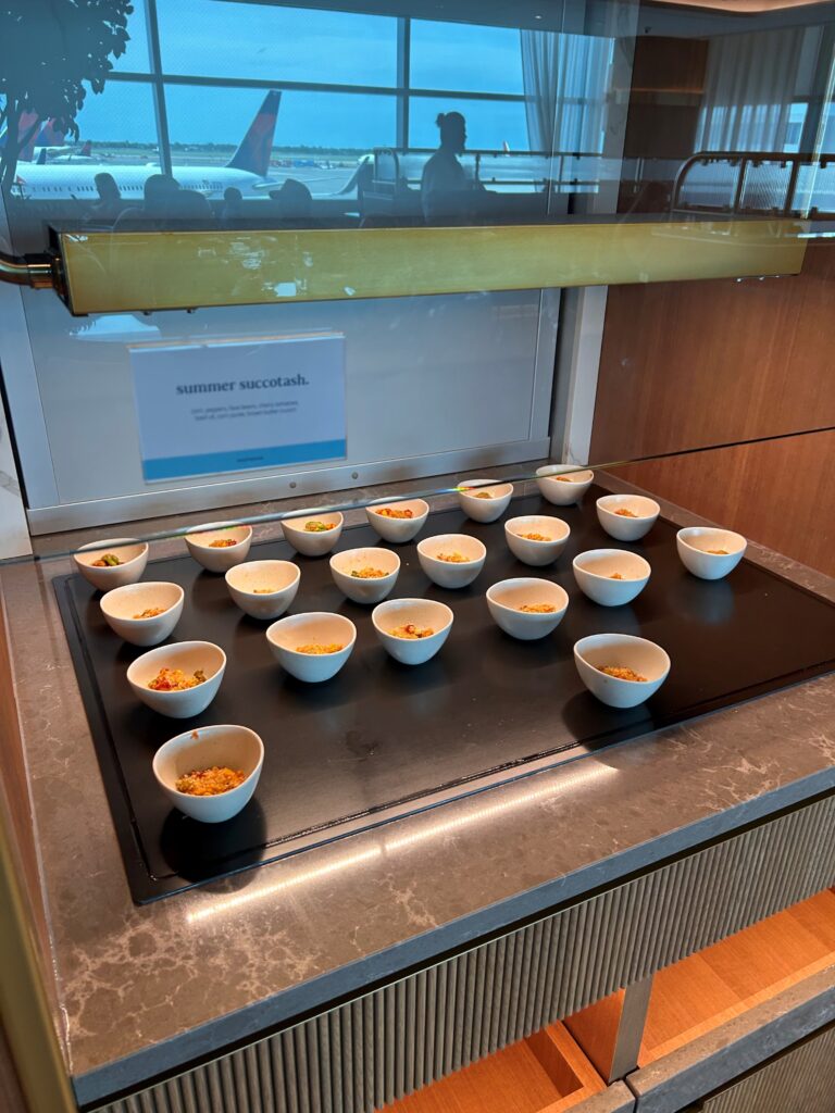 a group of small white bowls on a black surface