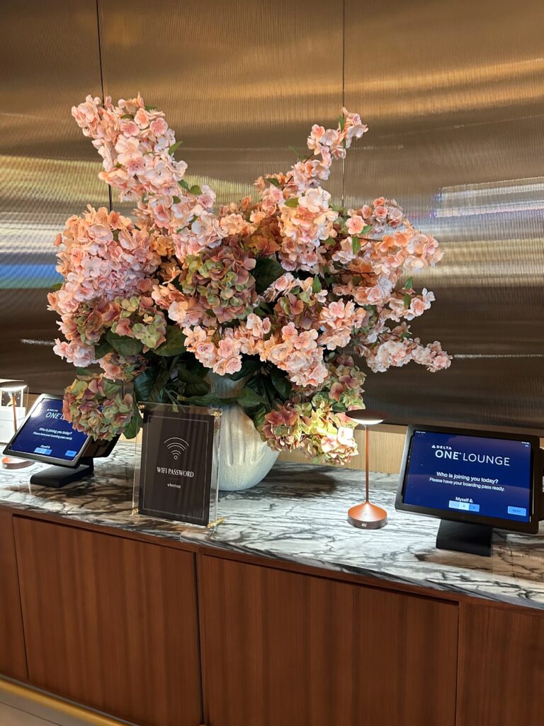a flower in a vase on a counter