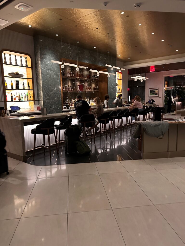 a group of people sitting at a bar