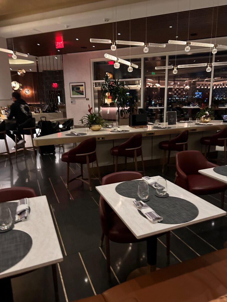 a restaurant with tables and chairs