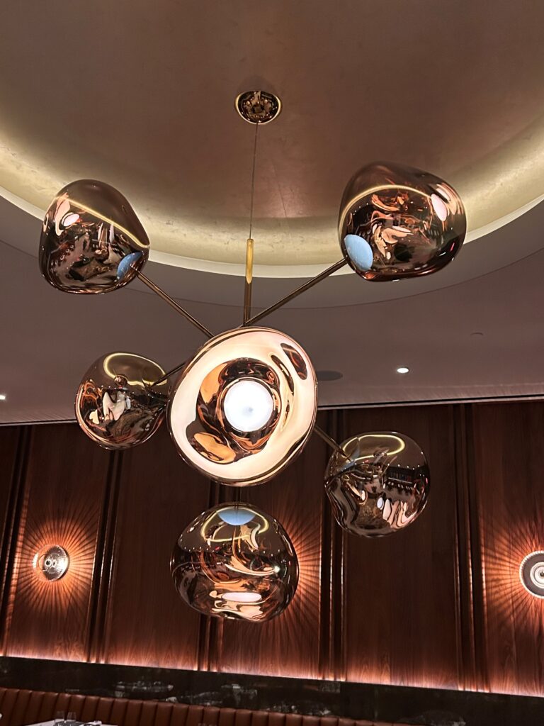 a chandelier with multiple lights from the ceiling