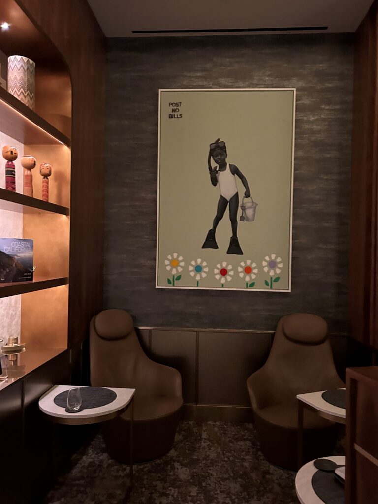 a room with a picture of a person holding a bucket
