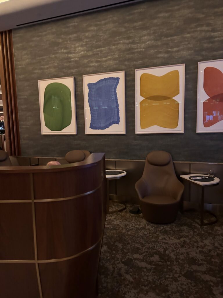 a reception desk and art on the wall