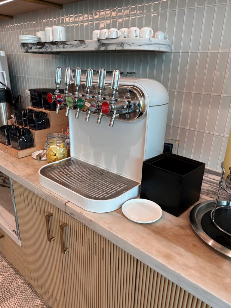 a white machine with silver handles on a counter