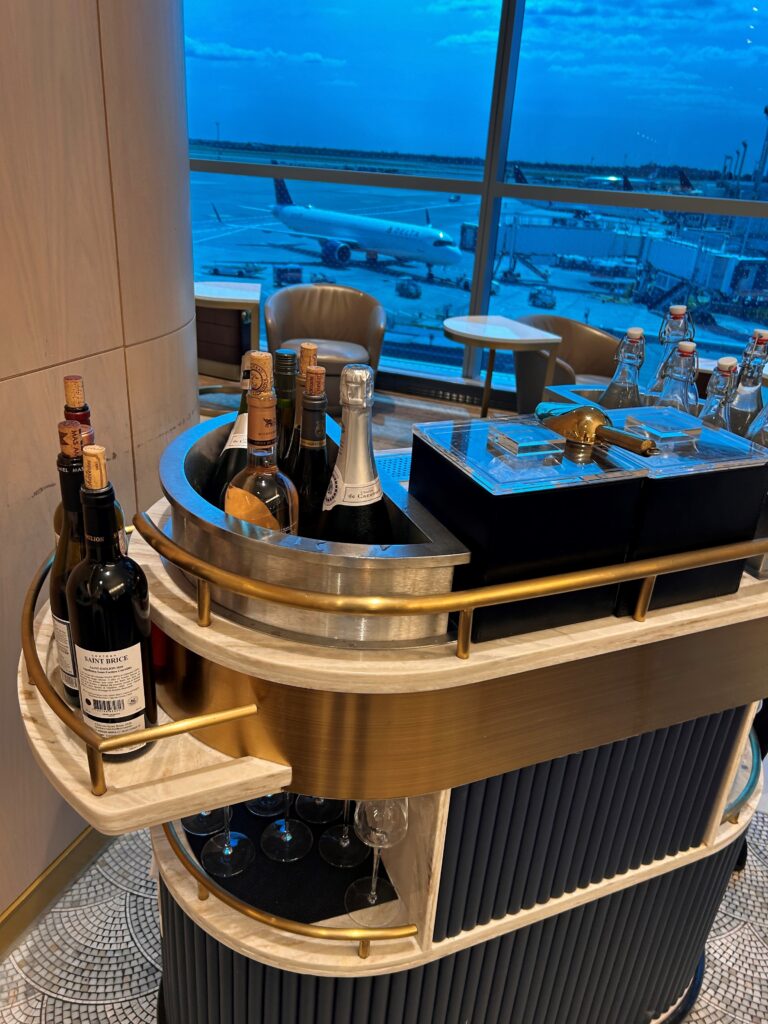 a bar with bottles of wine and glasses