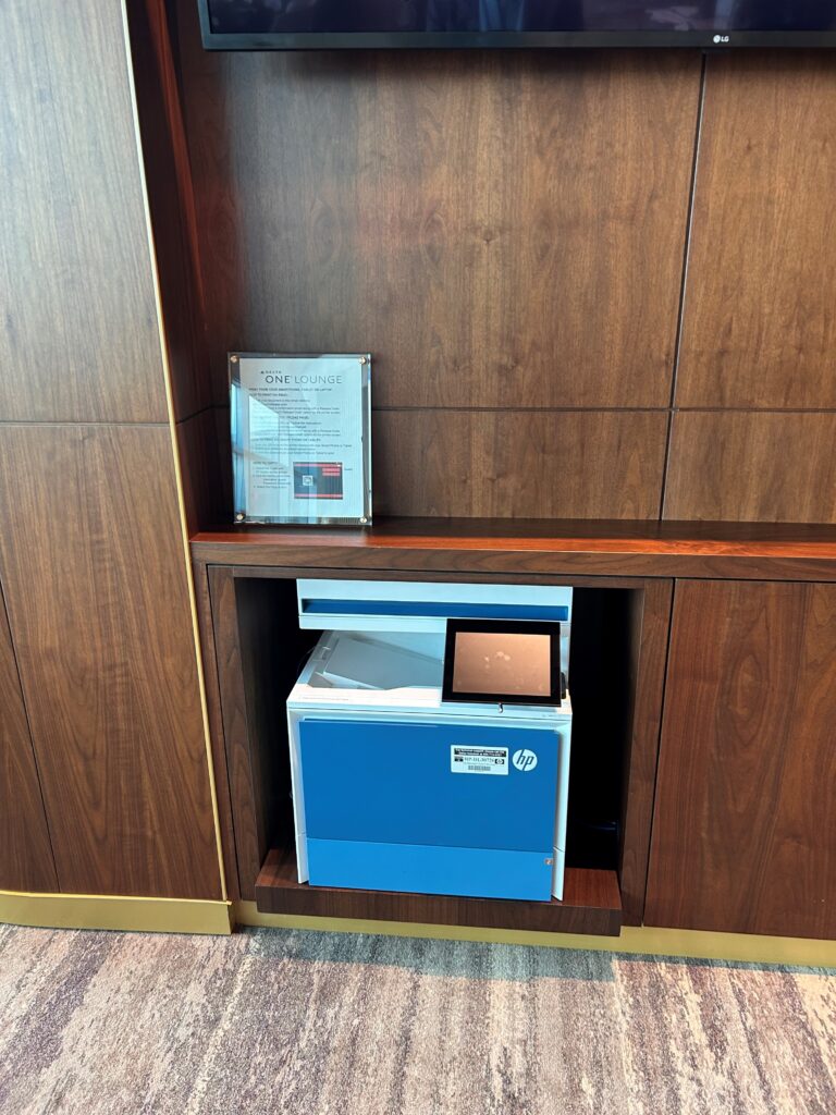 a small blue and white box in a wood shelf