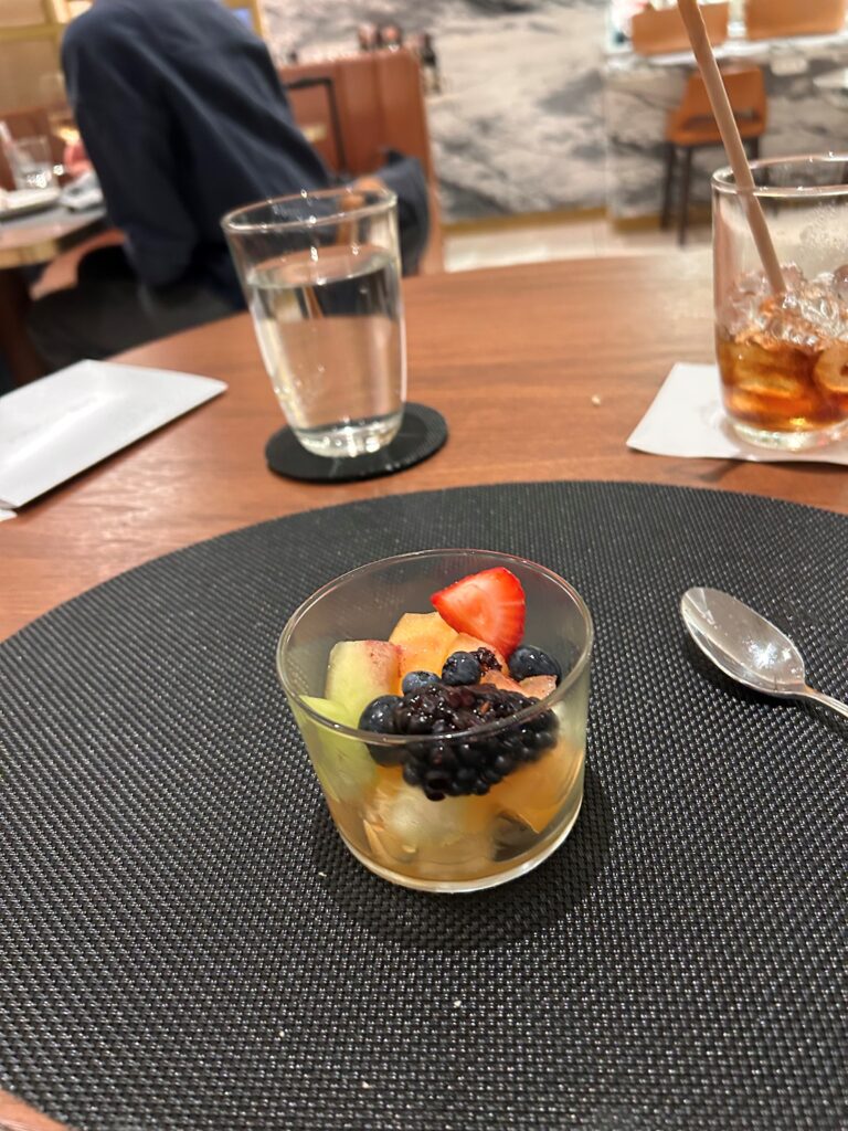 a bowl of fruit on a table