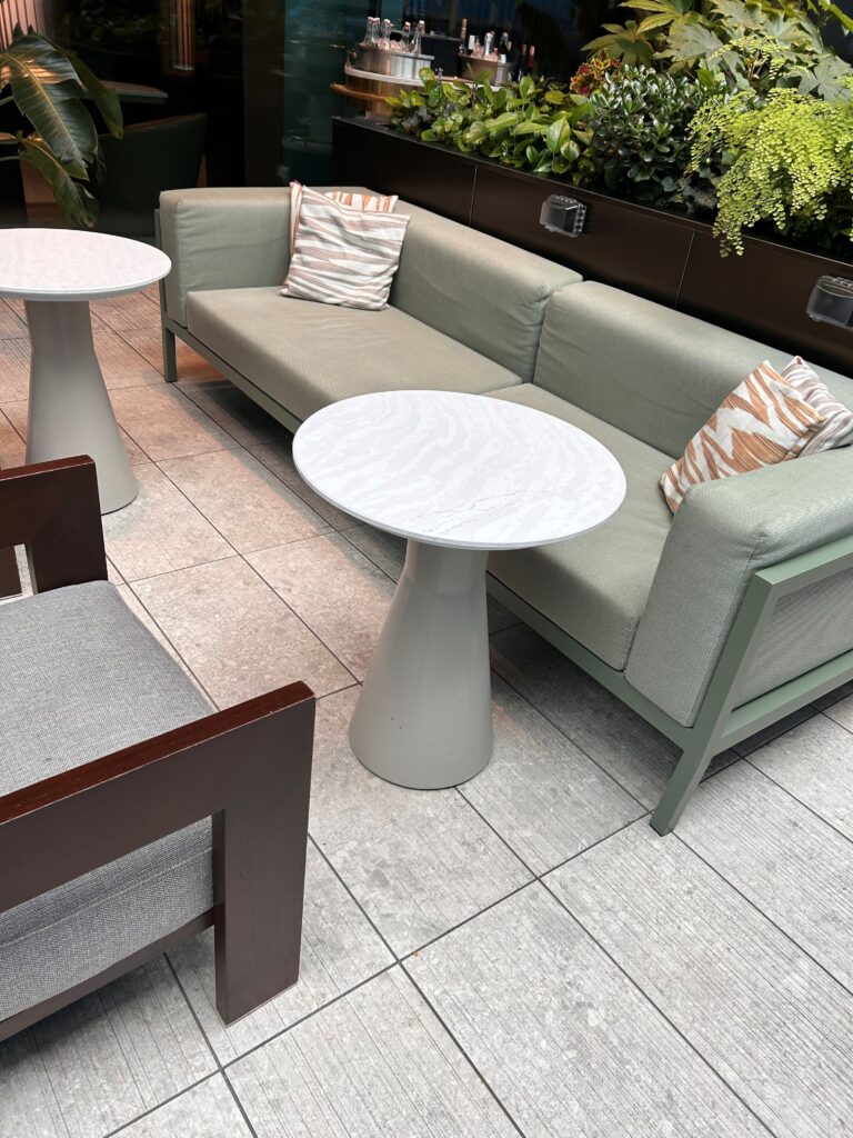 a couch and table on a tile floor