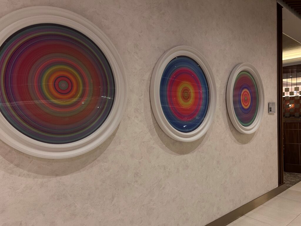 a group of circular art on a wall