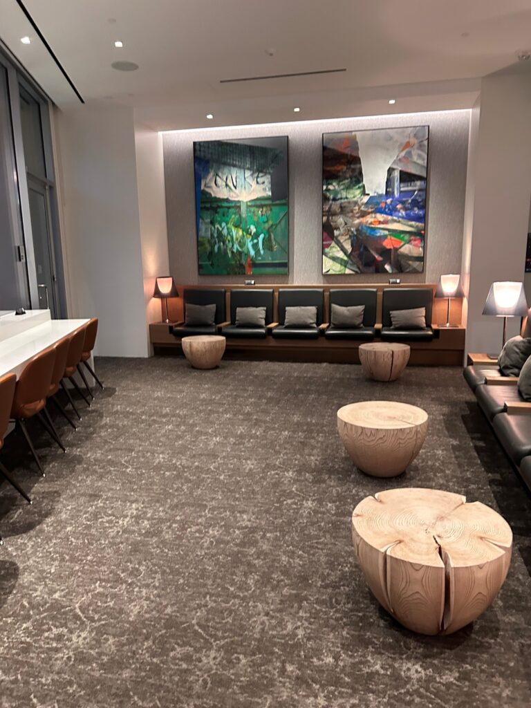 a room with a group of chairs and a table