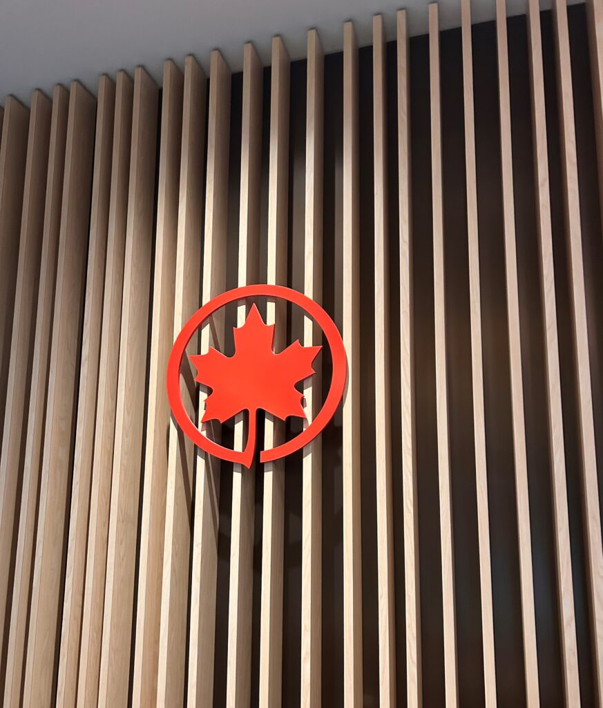 a red logo on a wall