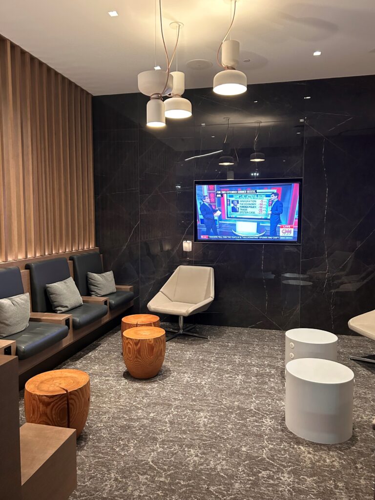 a room with a television and chairs