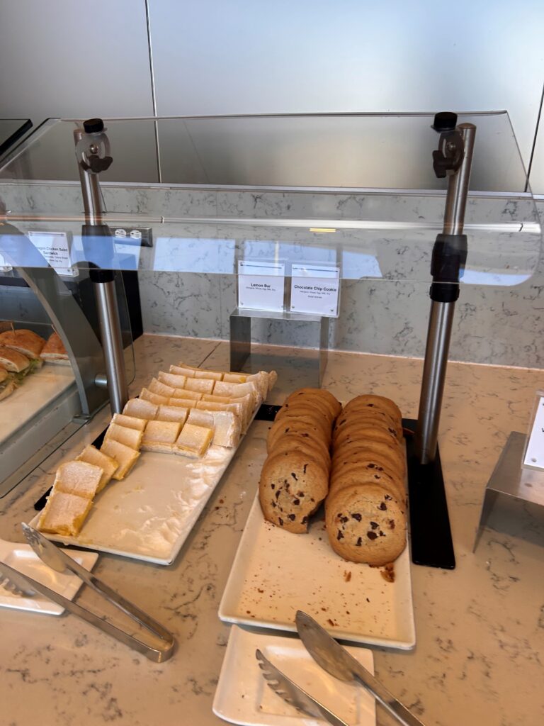 a tray of cookies and sandwiches