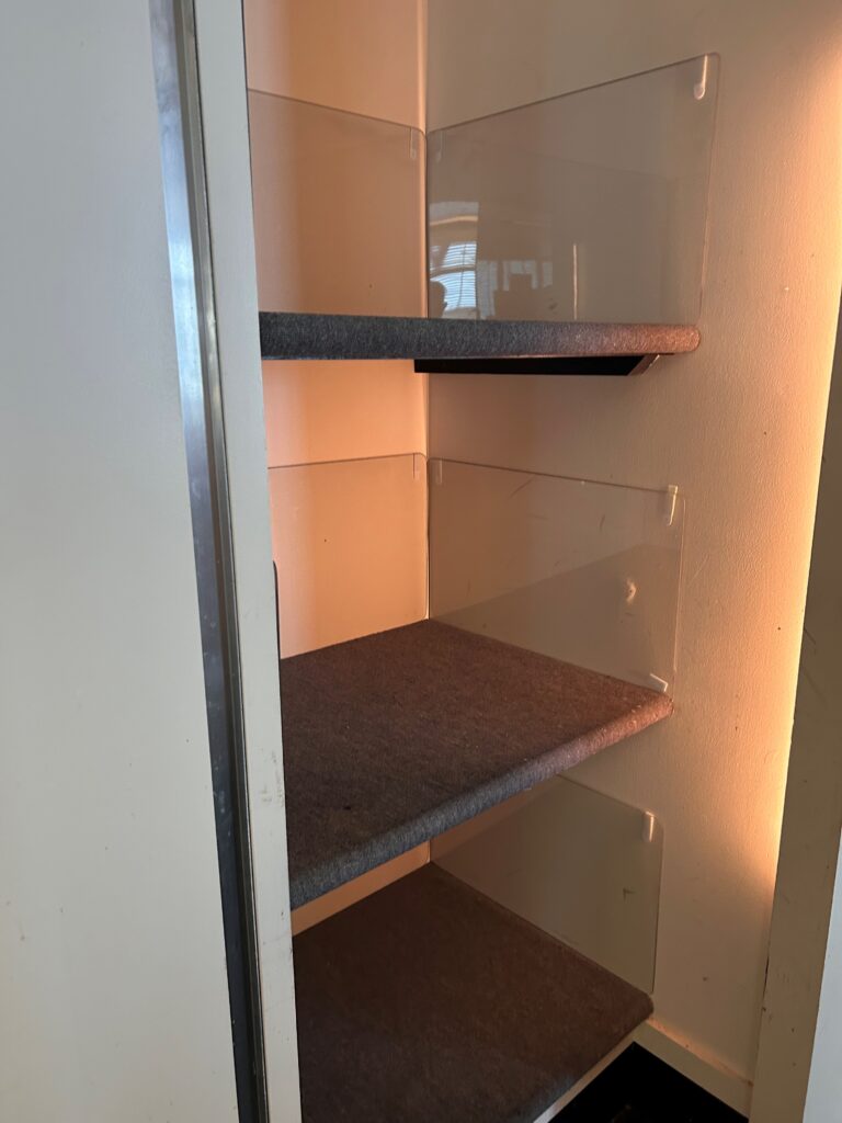 a shelf in a cabinet