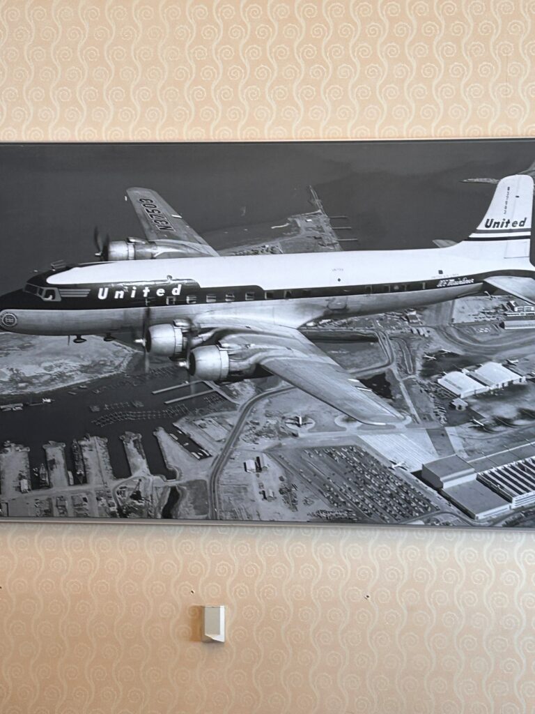a black and white picture of an airplane on a wall