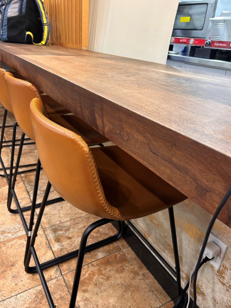 a table with chairs and a counter