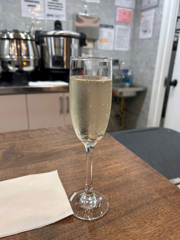 a glass of champagne on a table