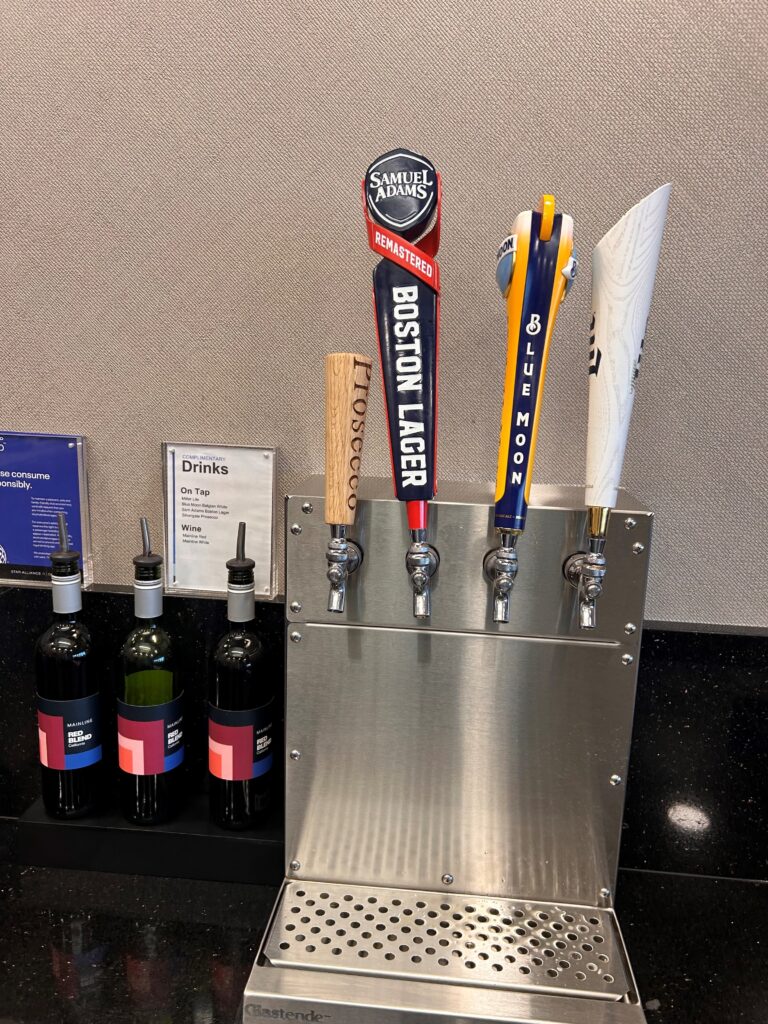 a group of beer taps on a metal stand