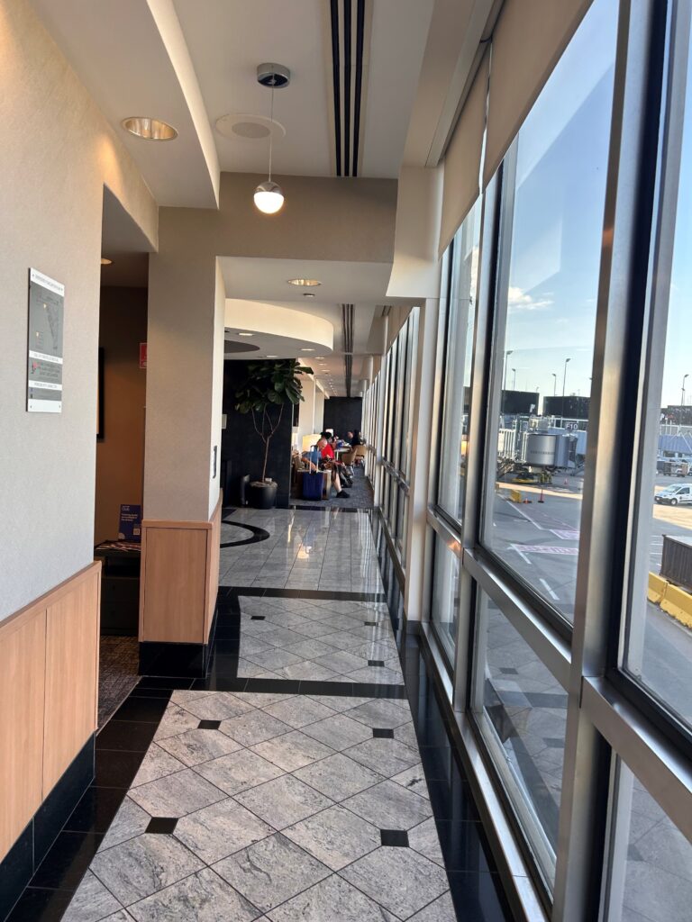 a hallway with large windows