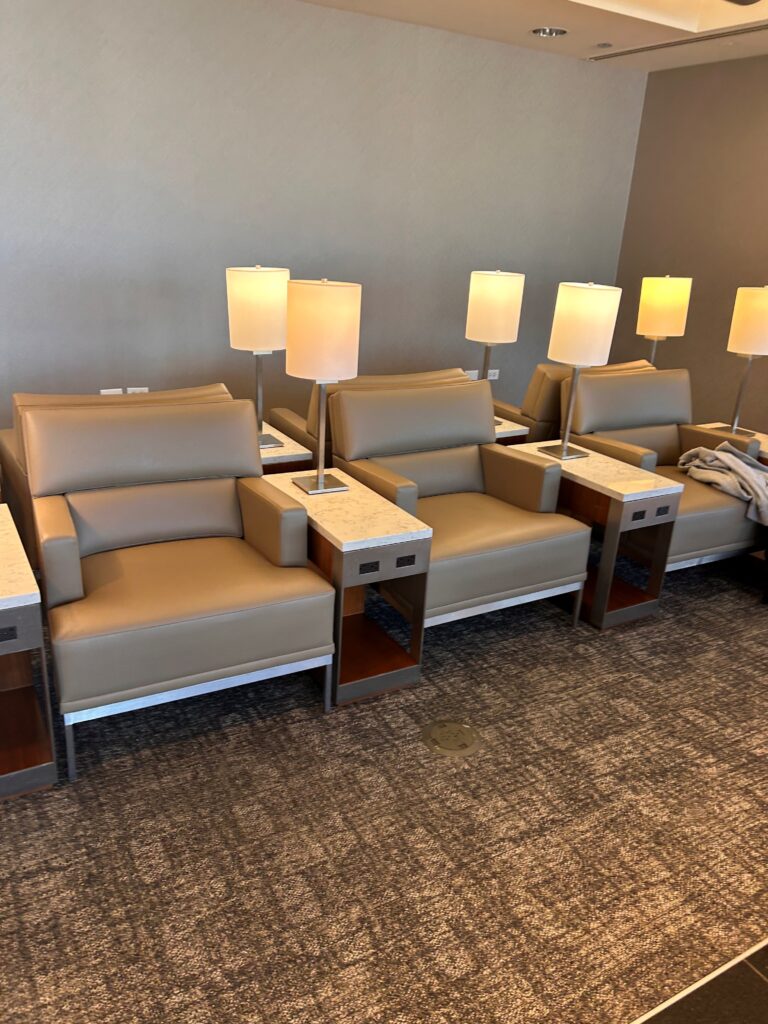 a group of chairs with lamps