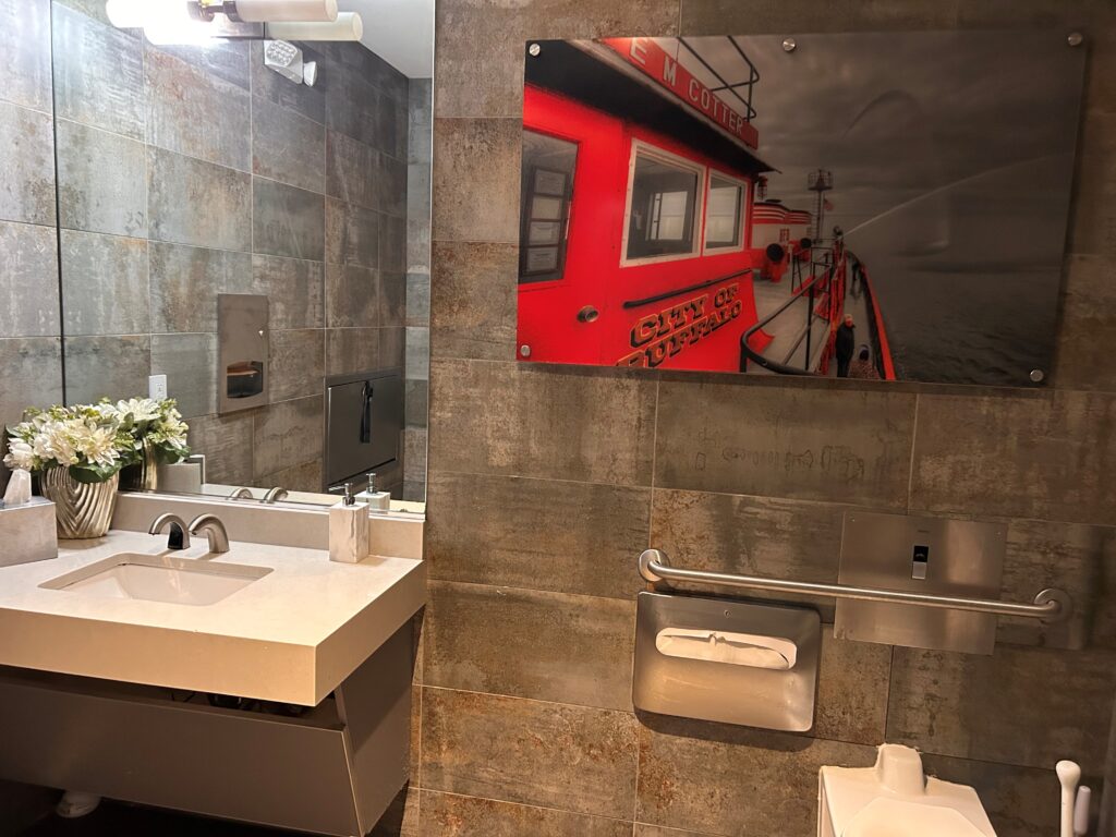 a bathroom with a mirror and sink