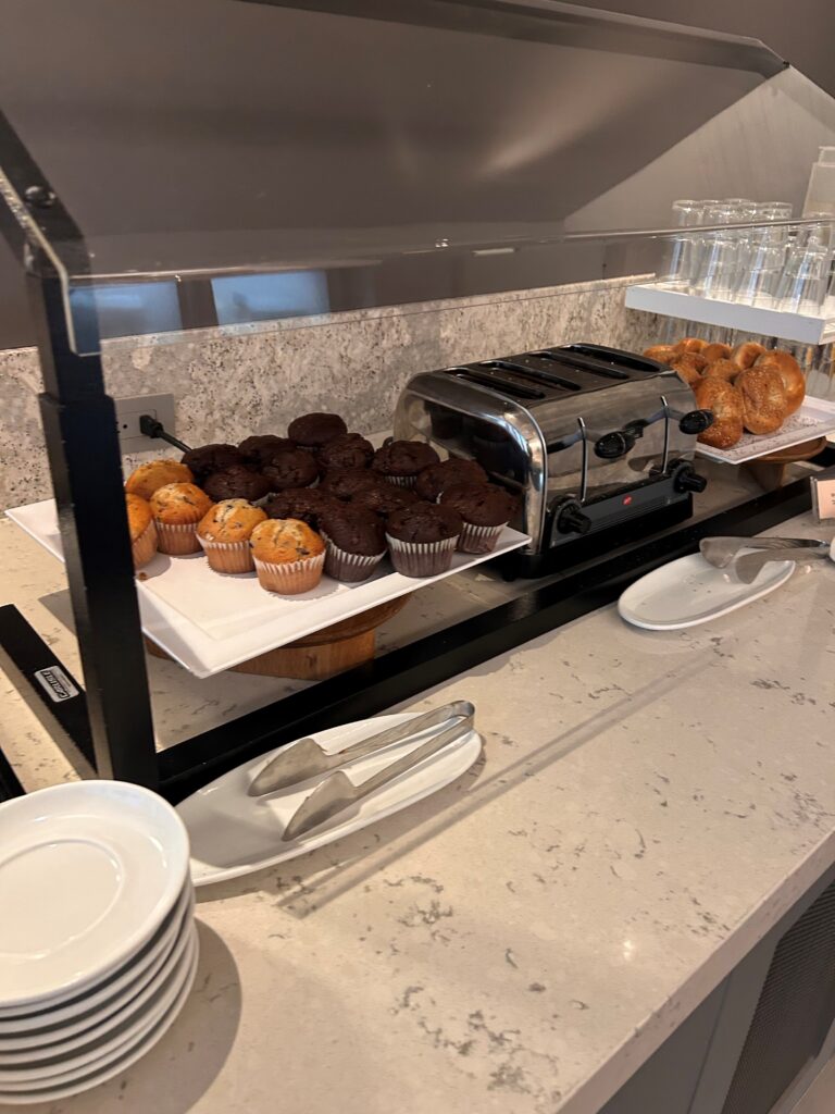 a buffet with a toaster and muffins