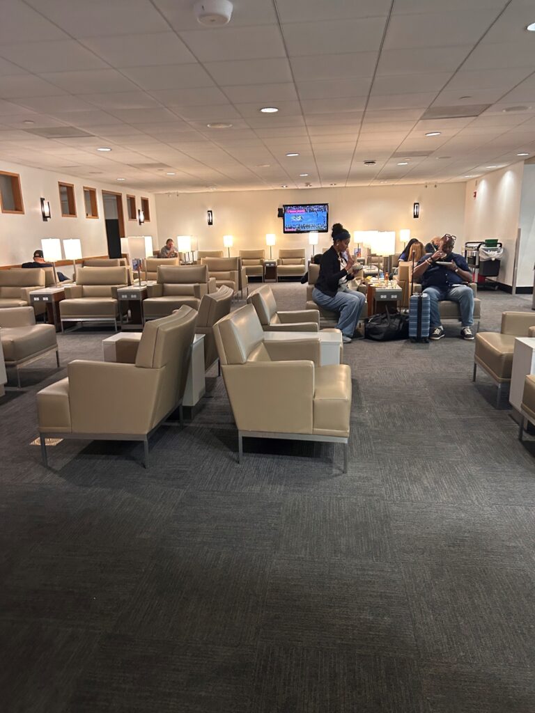 a group of people sitting in a lounge area
