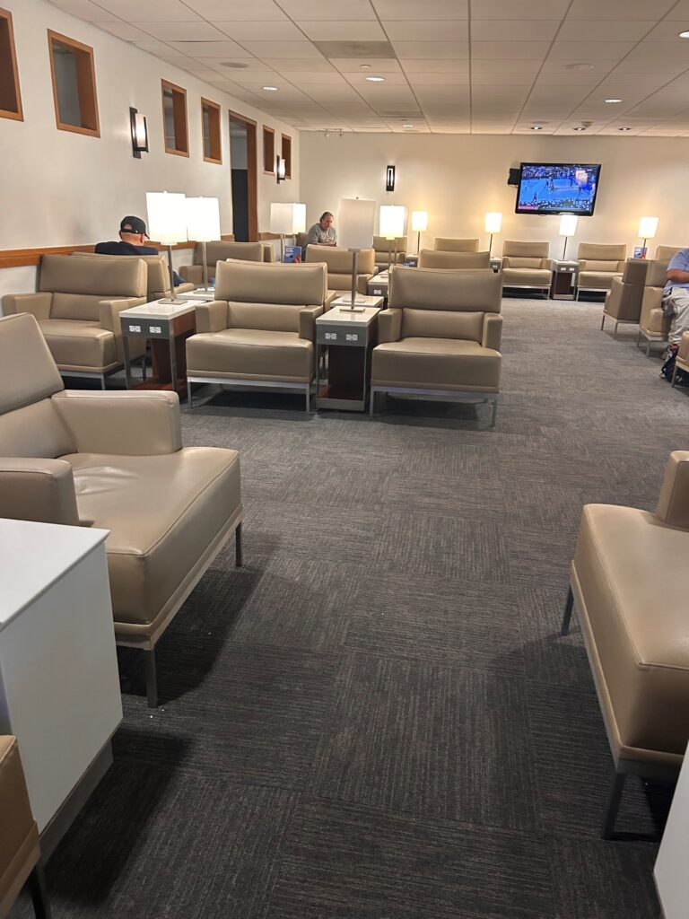 a room with many chairs and a television
